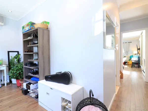 a view of a workspace with furniture and wooden floor