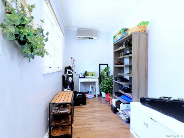 a living room with furniture and flat screen tv