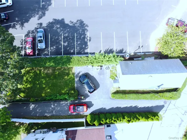 a view of a hall with wooden floor