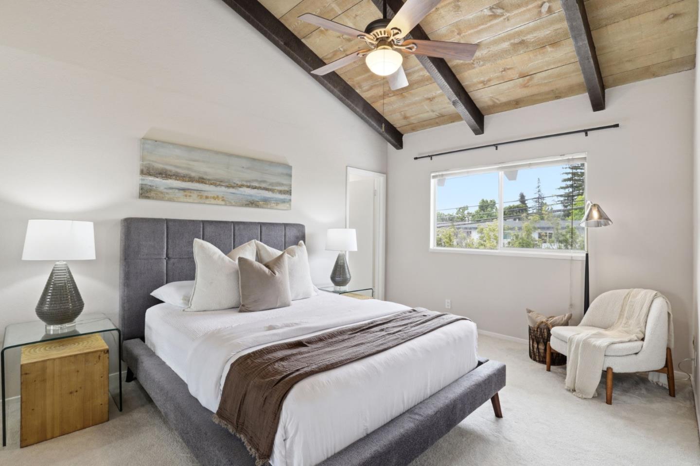255 South Rengstorff Avenue, Unit 2 Mountain View, CA 94040 - Photo 15 of 25 a bedroom with a large bed and a chandelier