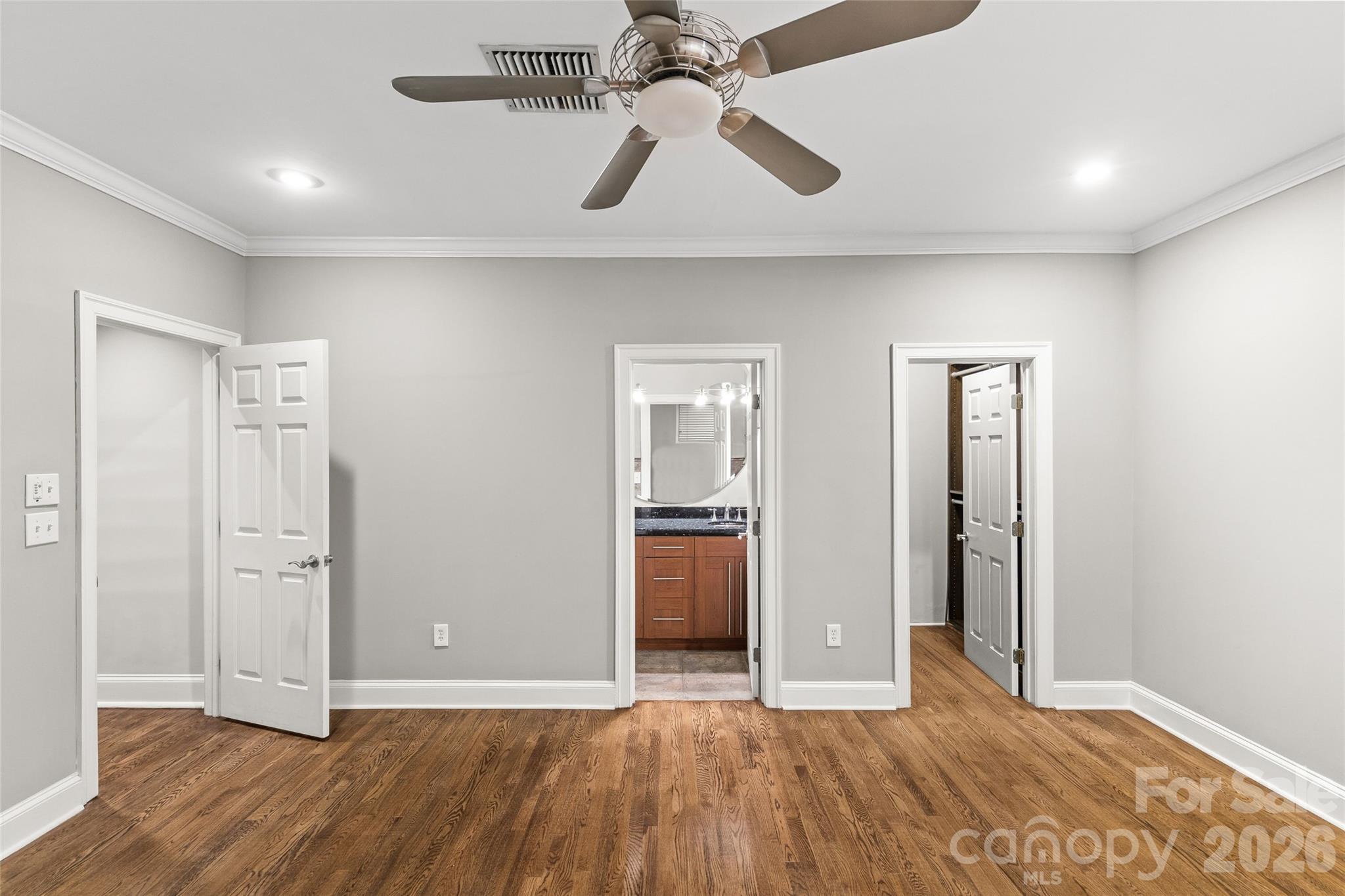 127 North Tryon Street, Unit 410 Charlotte, NC 28246 - Photo 11 of 37 a view of an empty room with window and wooden floor