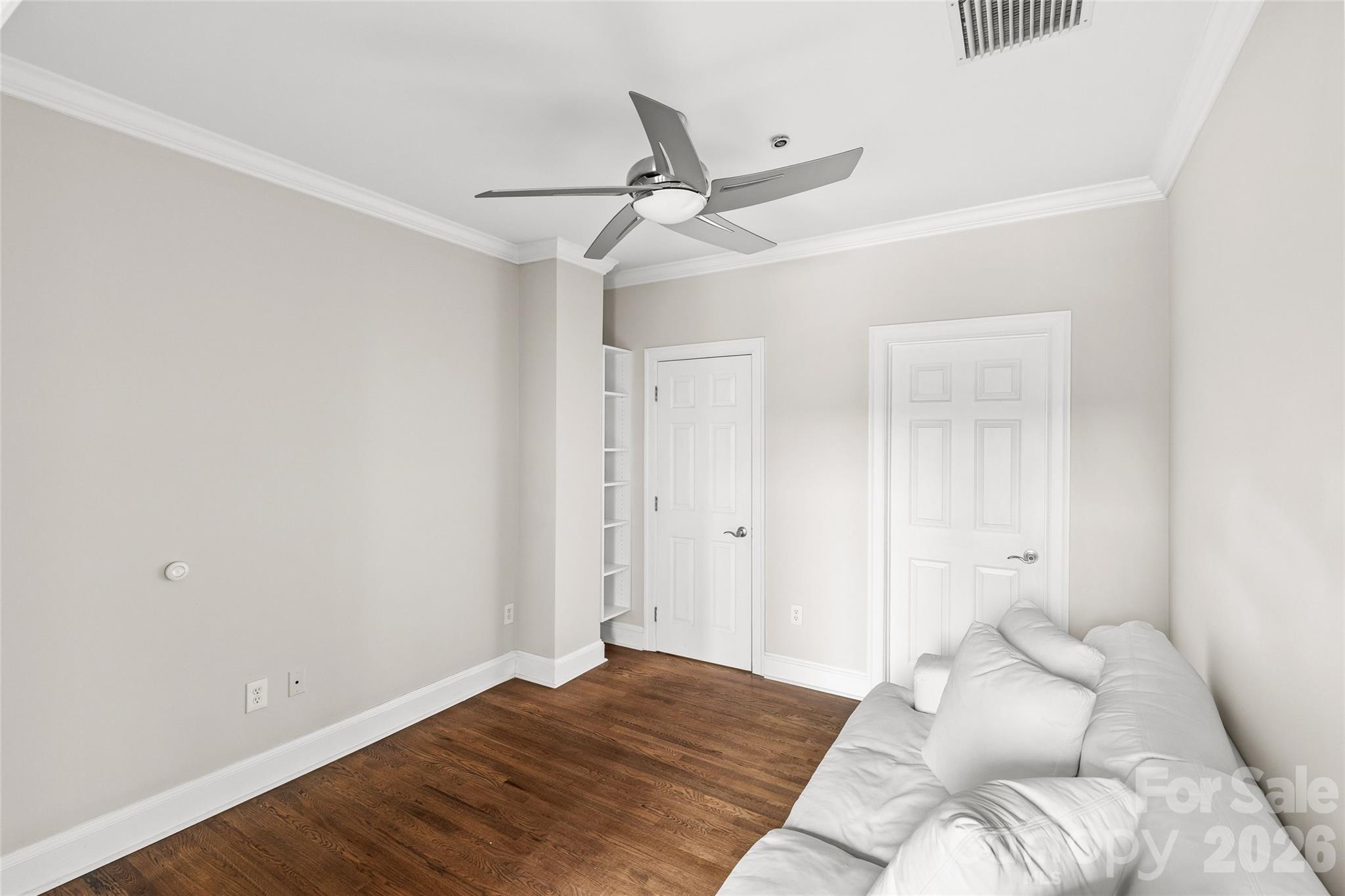 127 North Tryon Street, Unit 410 Charlotte, NC 28246 - Photo 23 of 37 a bedroom with a bed and closet