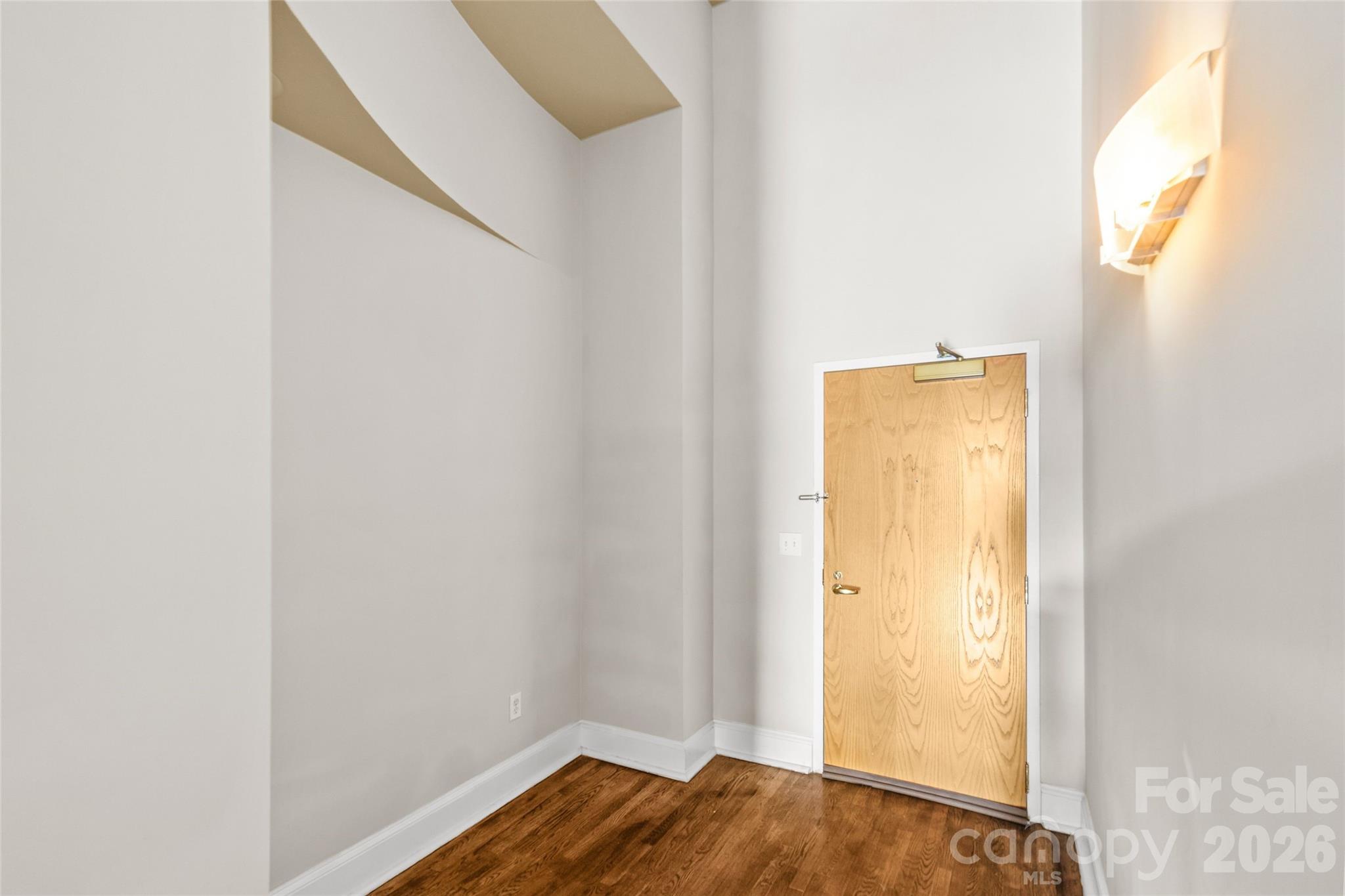 127 North Tryon Street, Unit 410 Charlotte, NC 28246 - Photo 8 of 37 a view of bedroom with a bed and a window