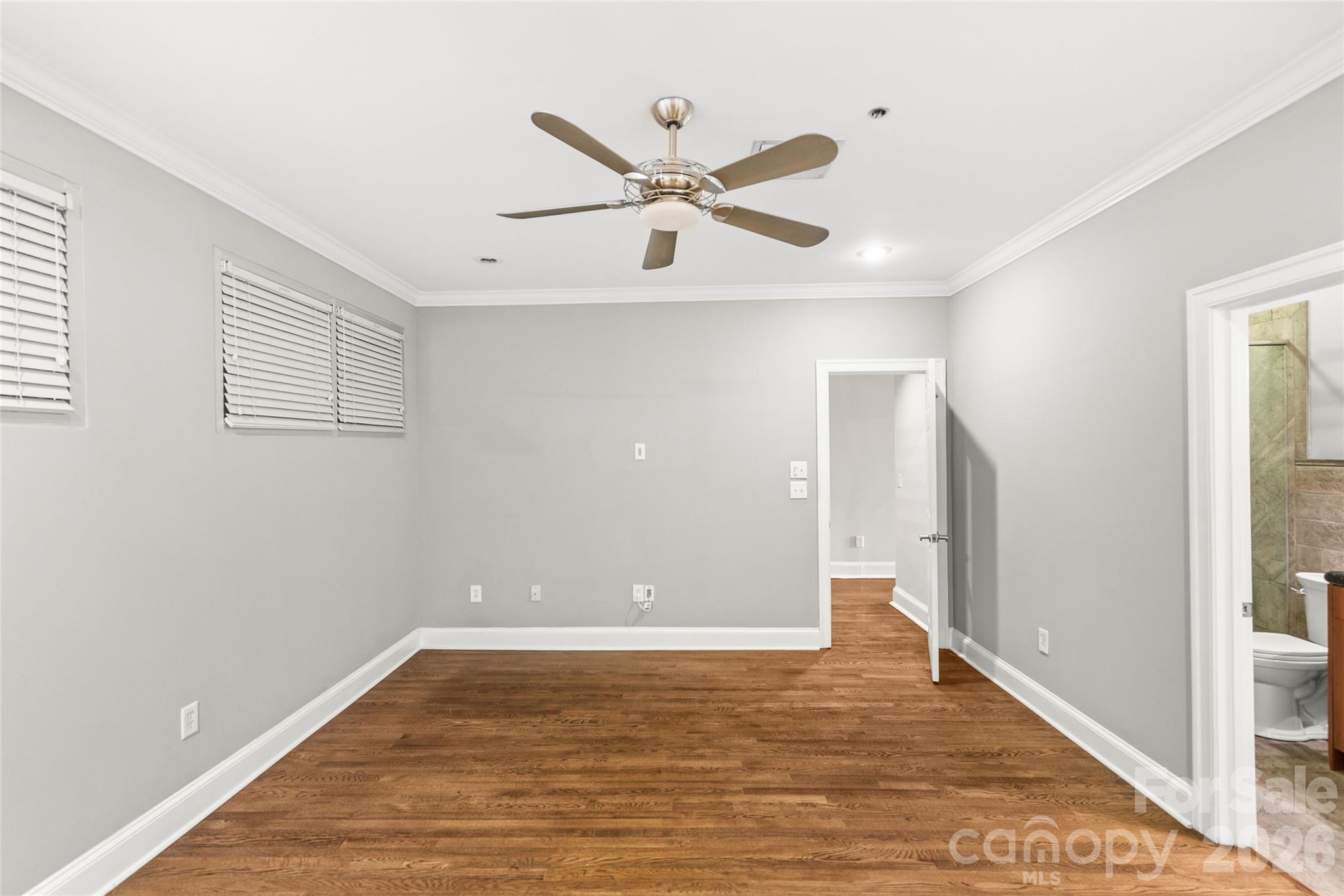 127 North Tryon Street, Unit 410 Charlotte, NC 28246 - Photo 9 of 37 a view of empty room with wooden floor
