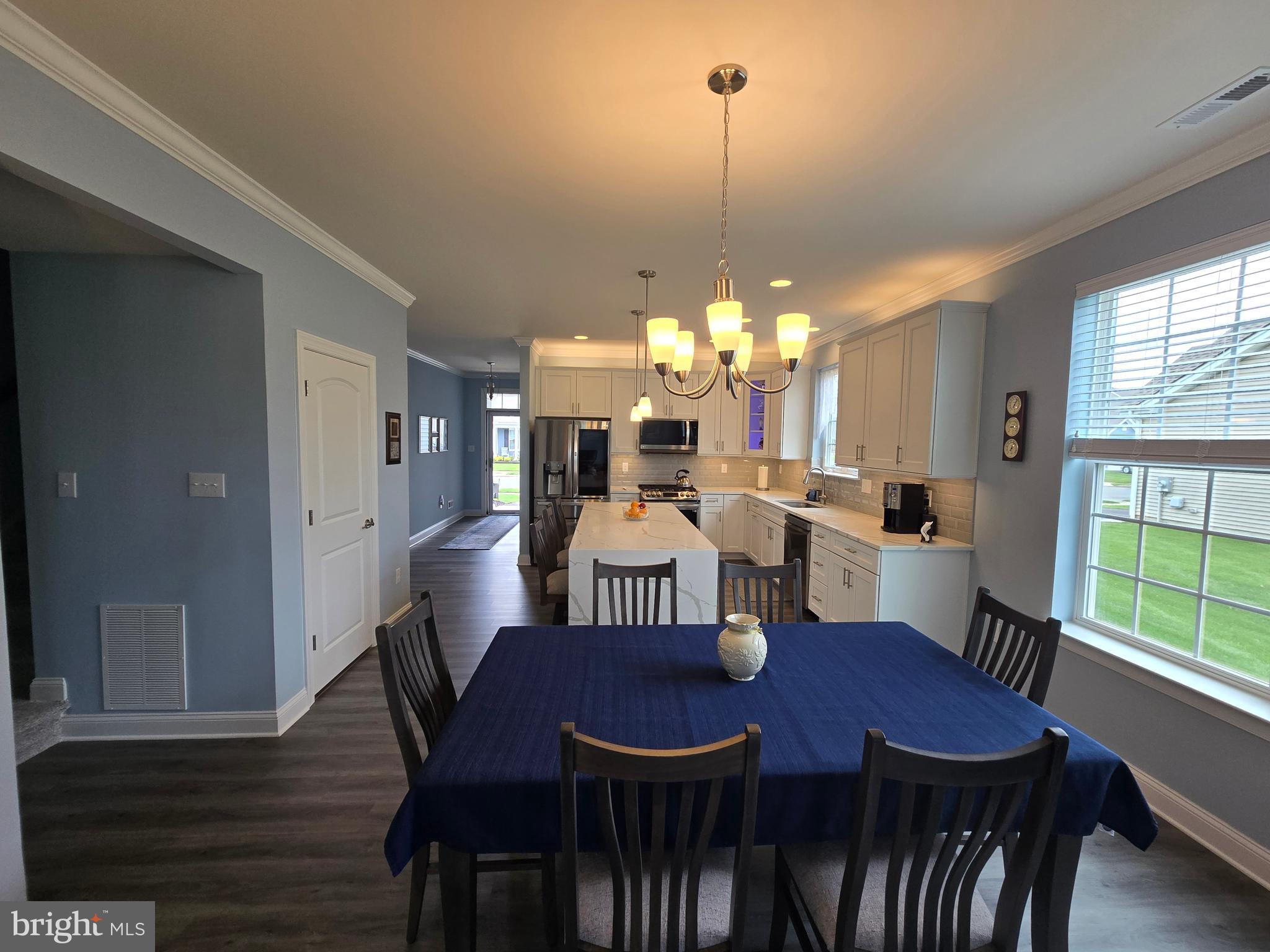 35 Queensferry Drive Williamstown, NJ 08094 - Photo 15 of 63 a view of a dining room with furniture a chandelier and wooden floor
