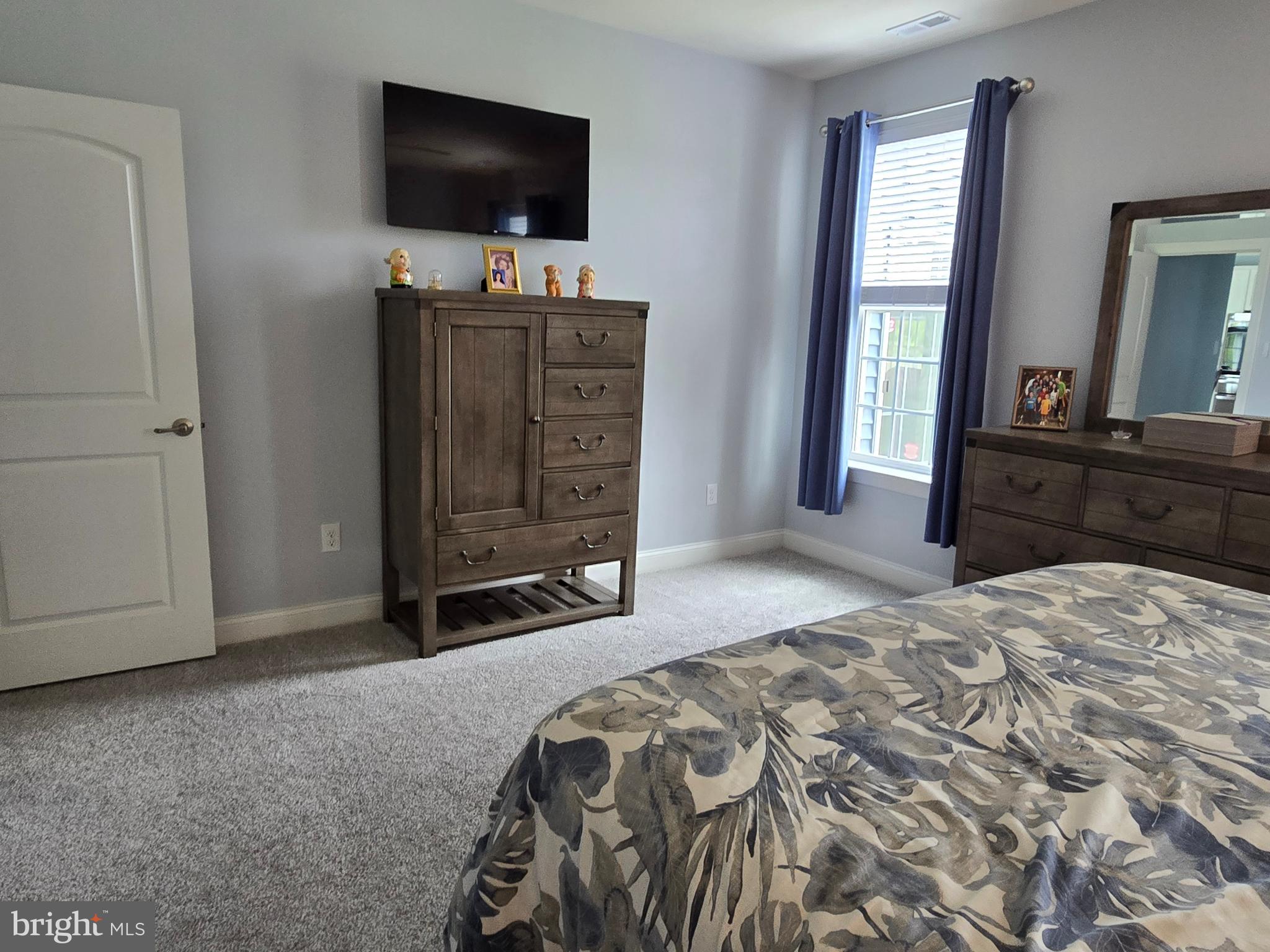 35 Queensferry Drive Williamstown, NJ 08094 - Photo 22 of 63 a bedroom with a bed and a flat tv screen on wall