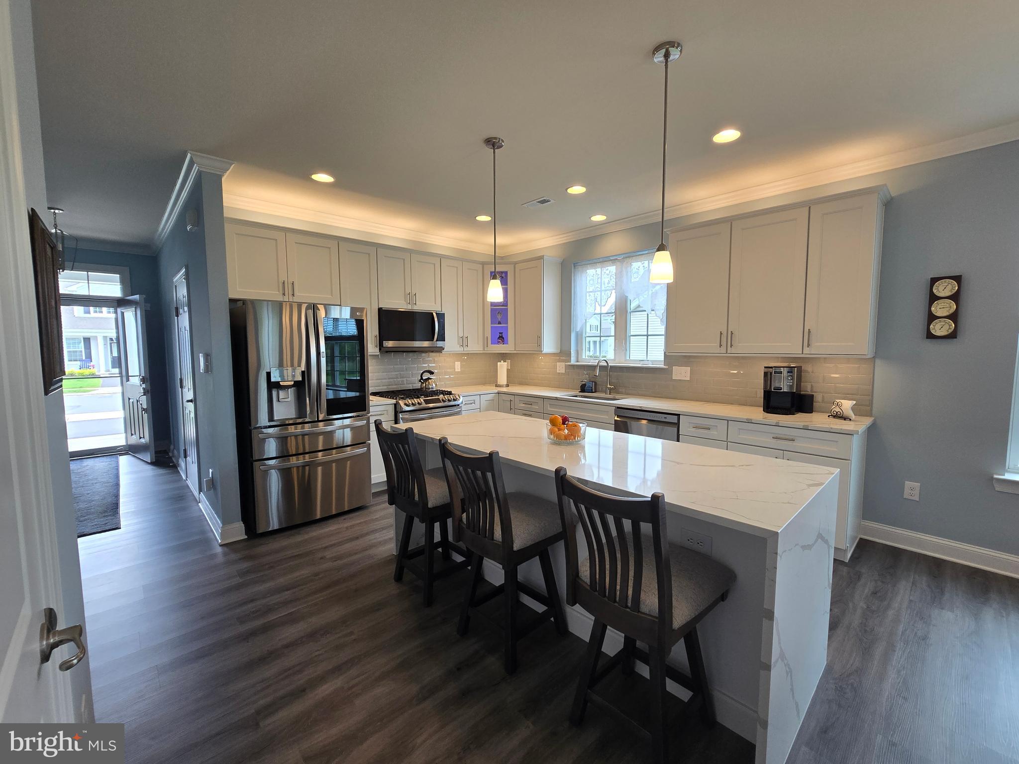 35 Queensferry Drive Williamstown, NJ 08094 - Photo 7 of 63 a kitchen with a dining table chairs wooden floor appliances and cabinets