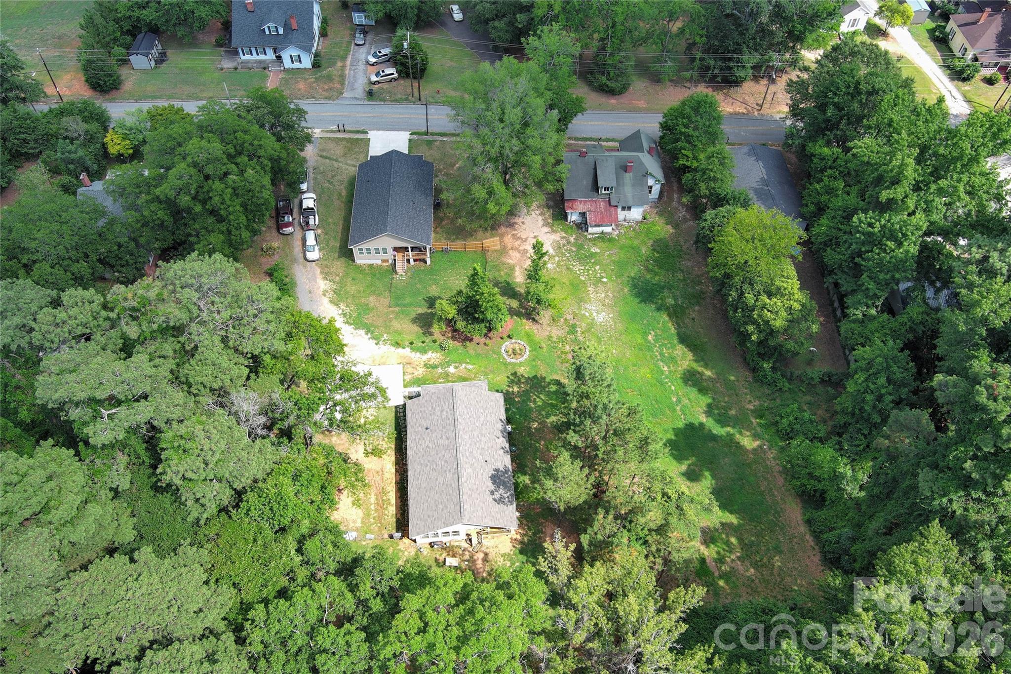 404 White Store Road Wadesboro, NC 28170 - Photo 36 of 38 an aerial view of a house with a yard and large trees