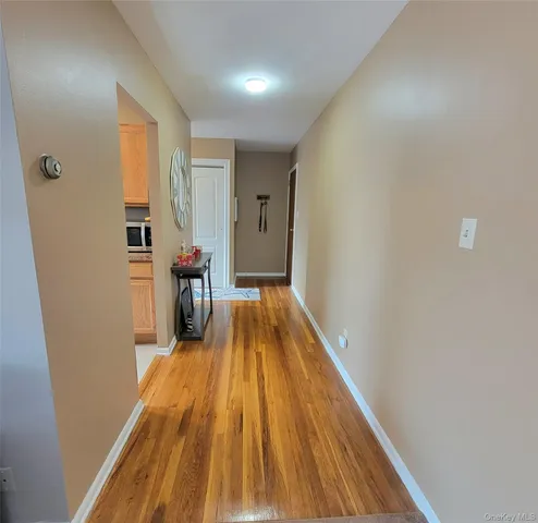 a view of a living room with a wooden floor