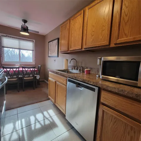 a kitchen with a sink and cabinets
