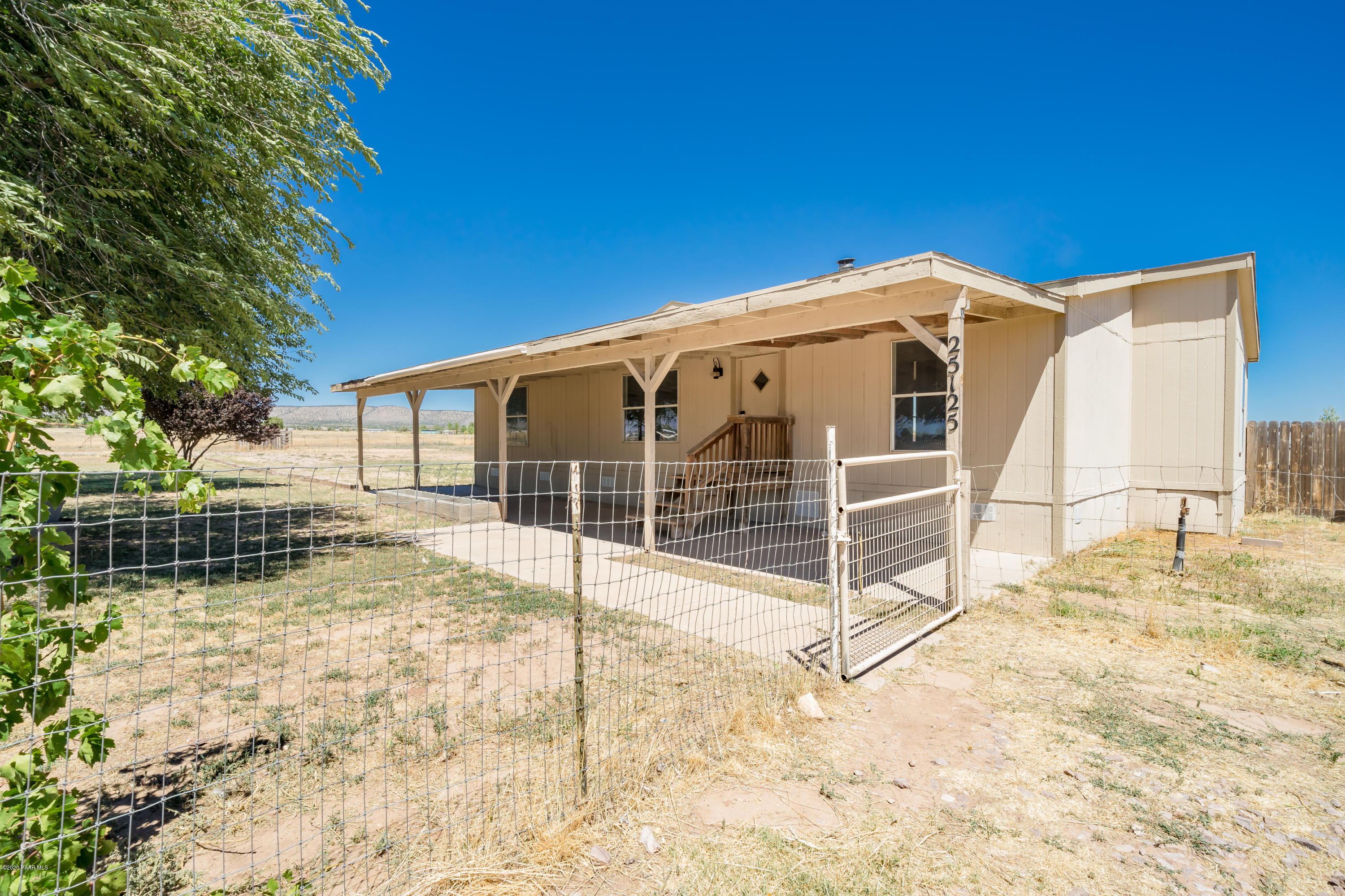 25125 North Mitchell Road Paulden, AZ 86334 - Photo 1 of 18 a view of a house with a backyard