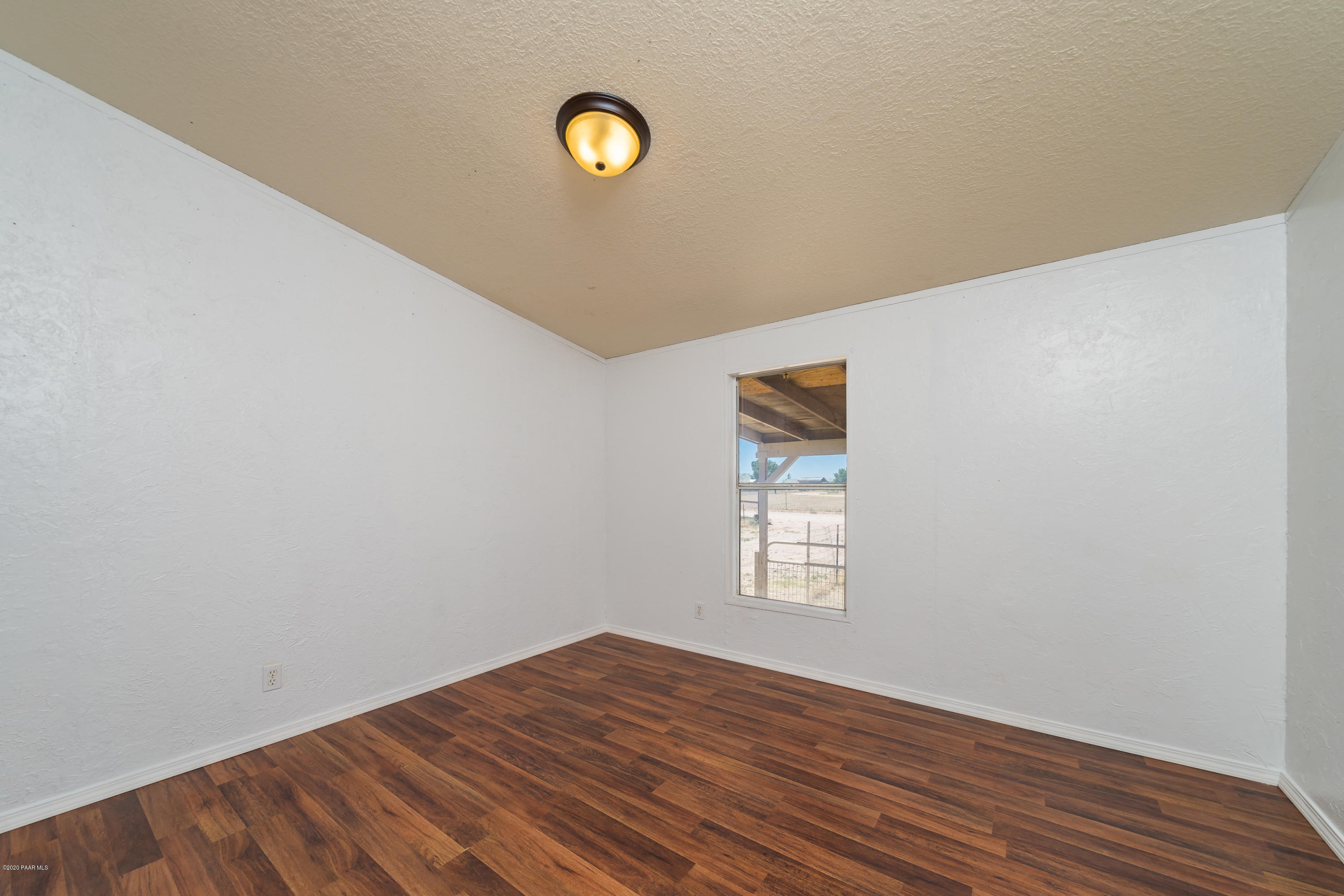 25125 North Mitchell Road Paulden, AZ 86334 - Photo 11 of 18 a view of a livingroom with wooden floor and a window