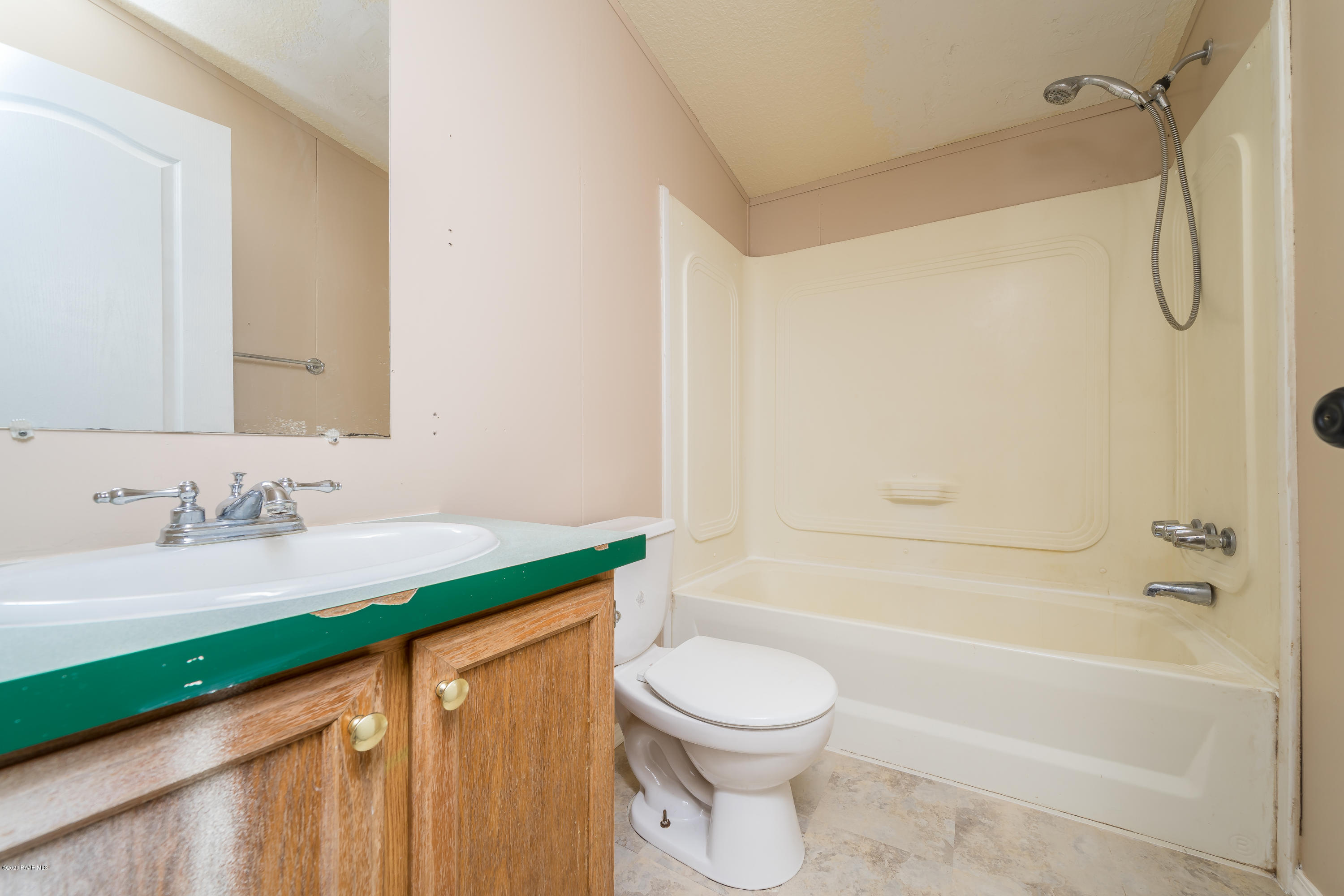 25125 North Mitchell Road Paulden, AZ 86334 - Photo 12 of 18 a bathroom with a granite countertop sink a toilet and shower