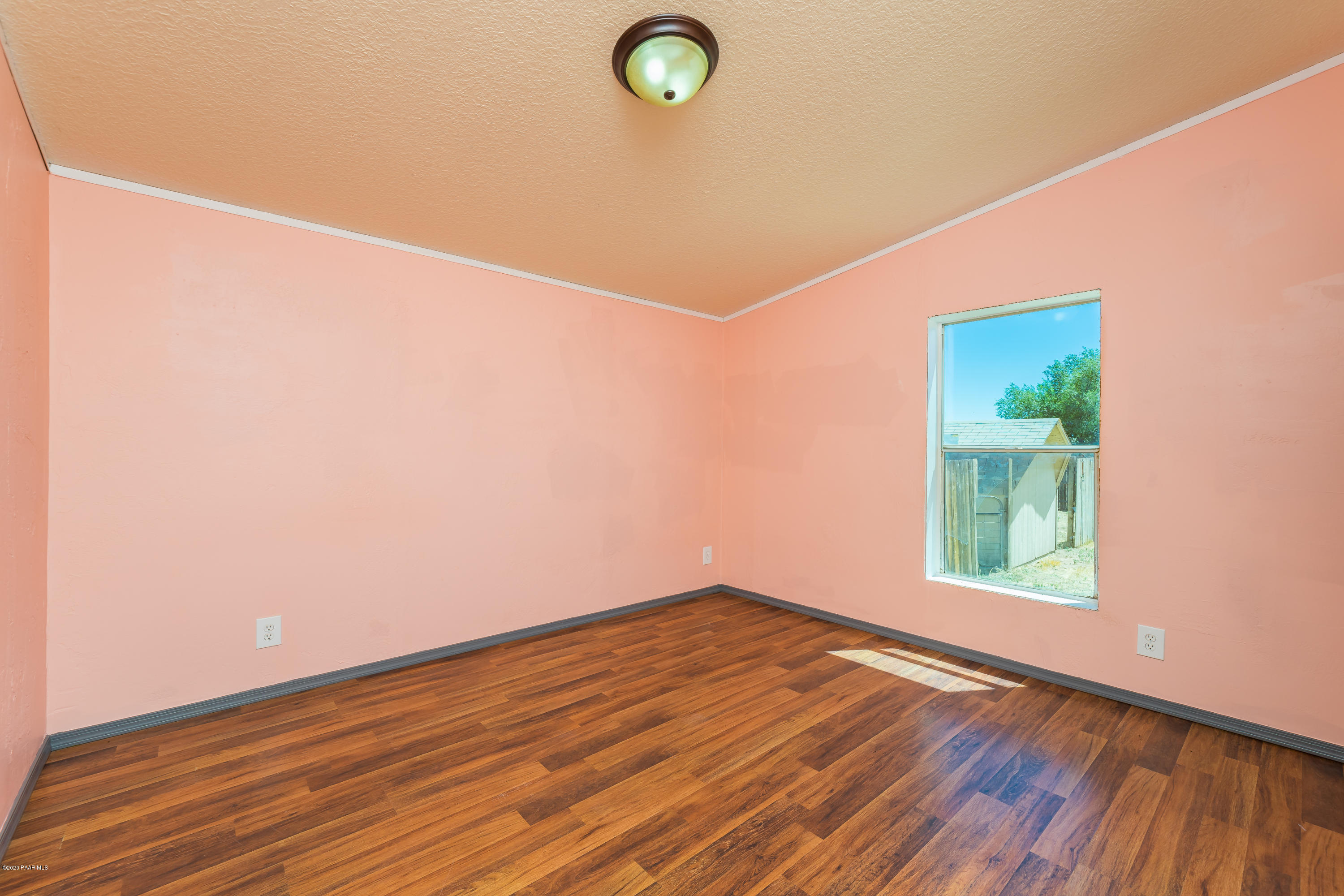 25125 North Mitchell Road Paulden, AZ 86334 - Photo 13 of 18 a view of a room with wooden floor and window
