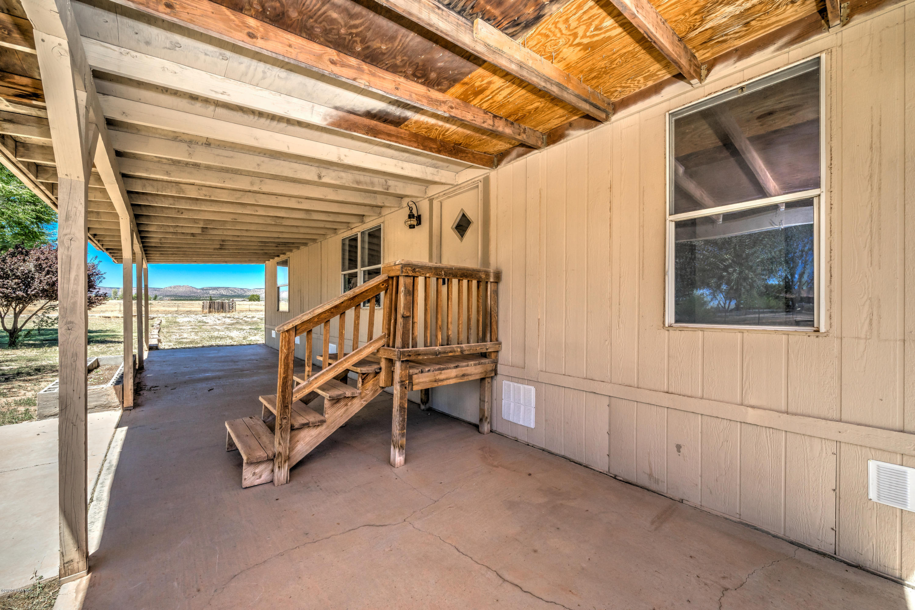 25125 North Mitchell Road Paulden, AZ 86334 - Photo 3 of 18 a view of staircase with a white walls and a window