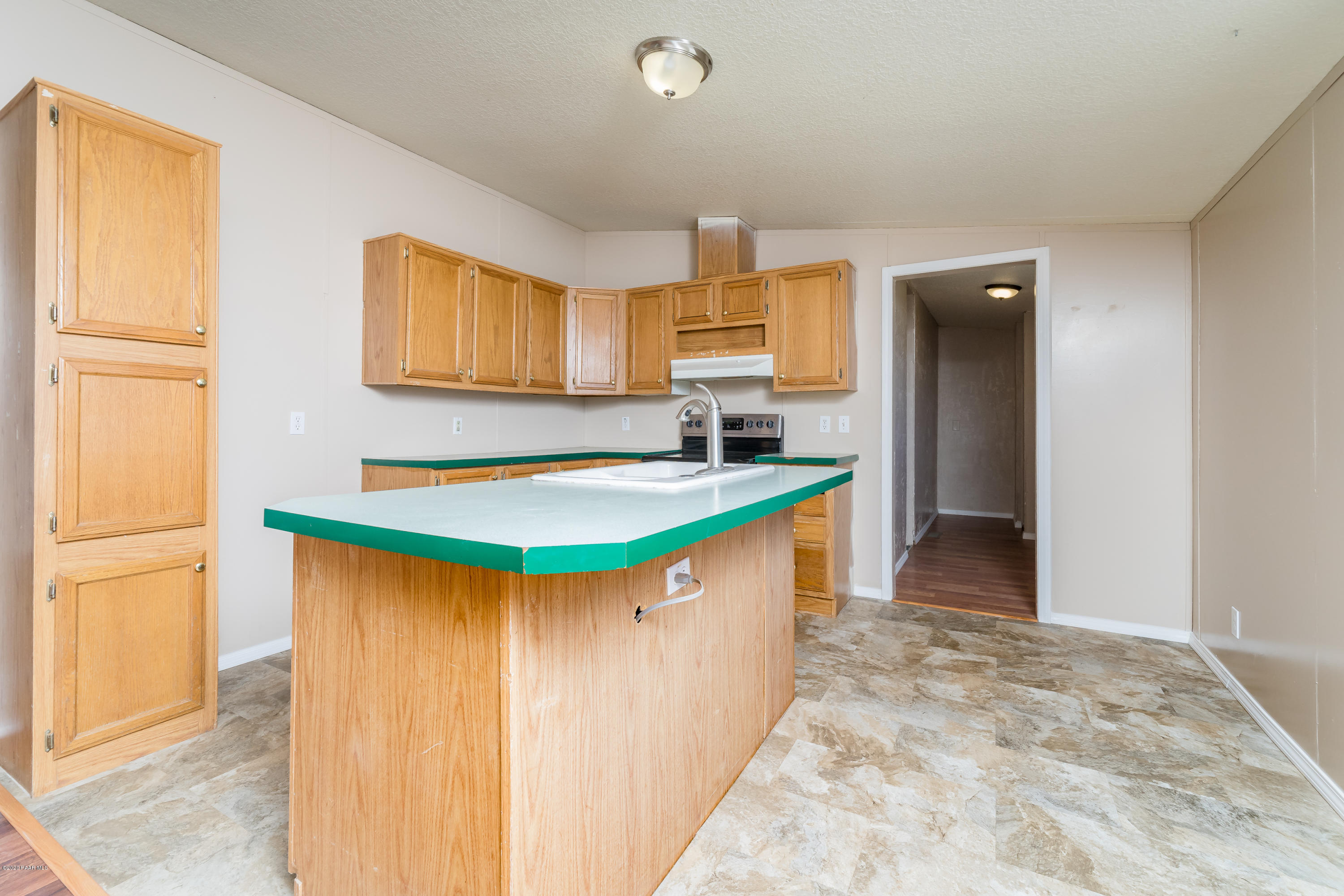 25125 North Mitchell Road Paulden, AZ 86334 - Photo 5 of 18 a kitchen with stainless steel appliances granite countertop a sink and a refrigerator
