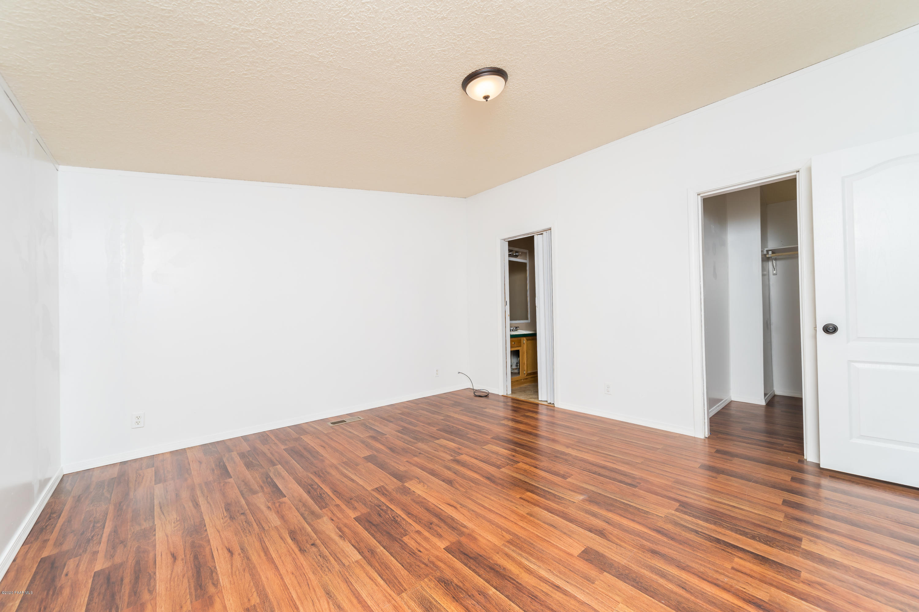 25125 North Mitchell Road Paulden, AZ 86334 - Photo 7 of 18 a view of an empty room with wooden floor