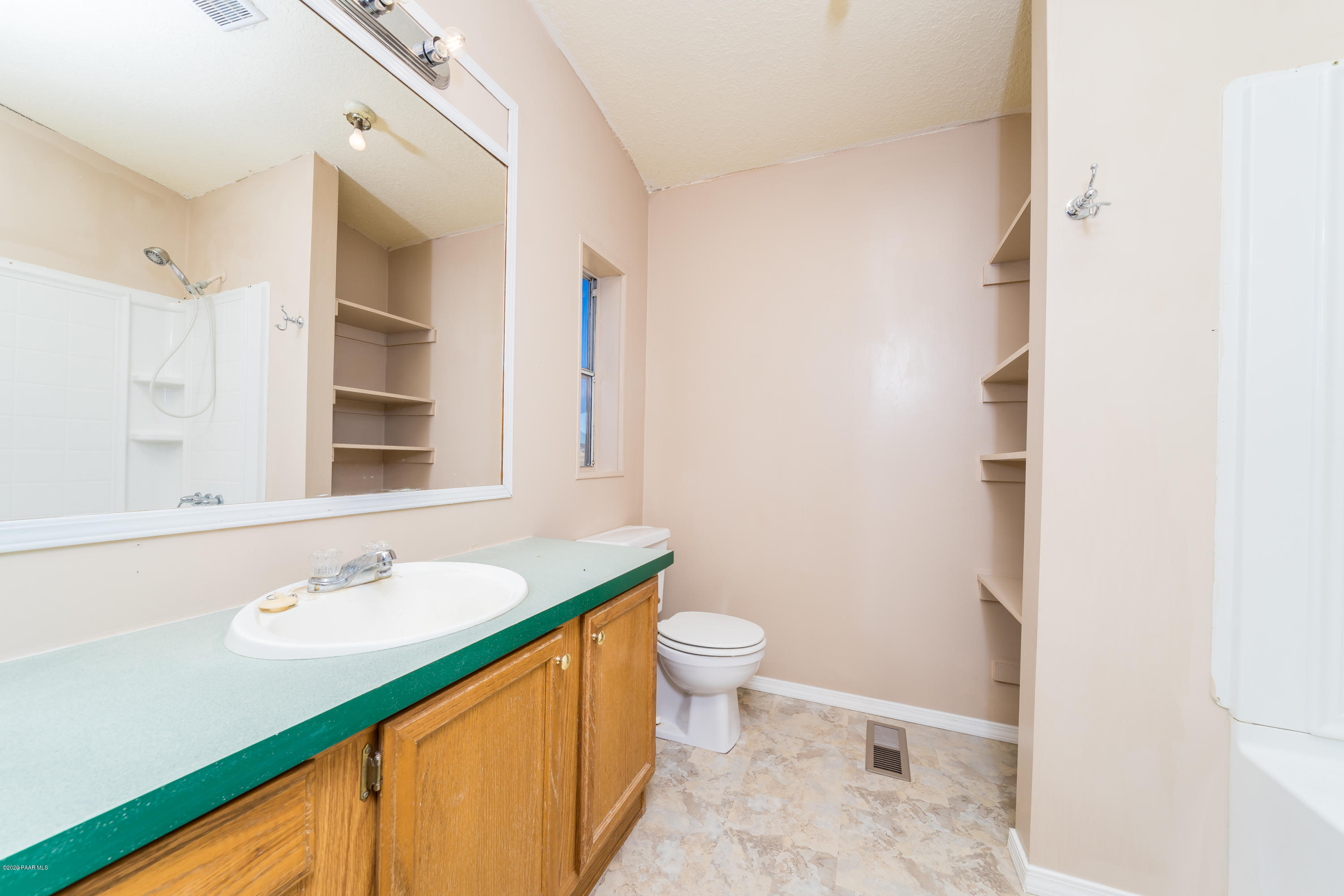 25125 North Mitchell Road Paulden, AZ 86334 - Photo 9 of 18 a bathroom with a sink and a mirror