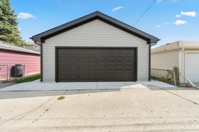 a front view of a house with garage