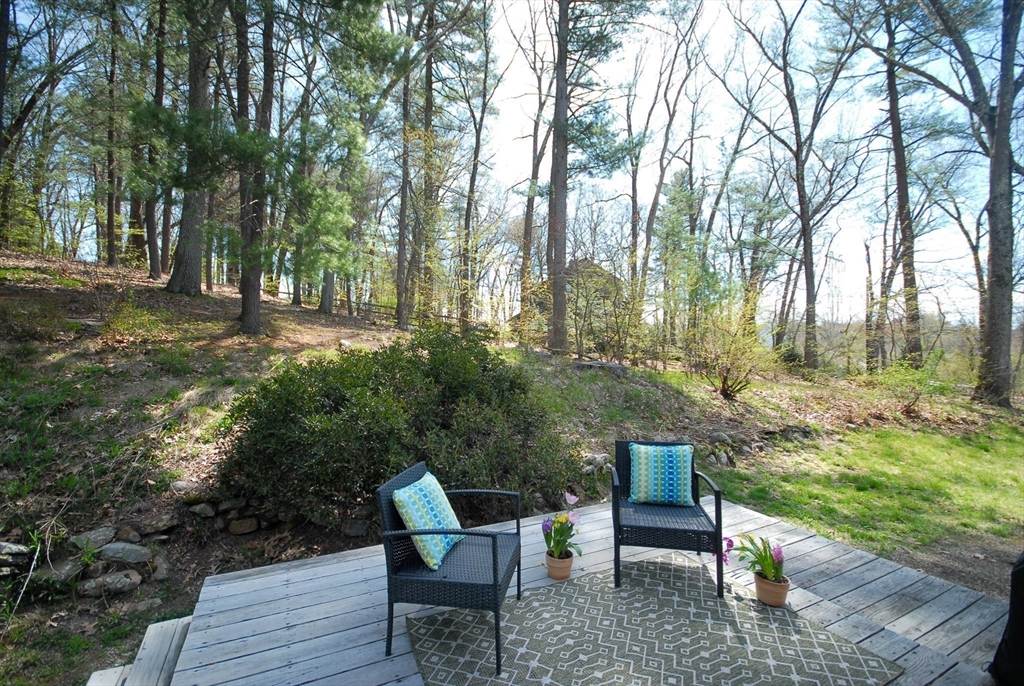 1 Pomfret Road Chelmsford, MA 01824 - Photo 4 of 28 a wooden bench sitting in the middle of a yard