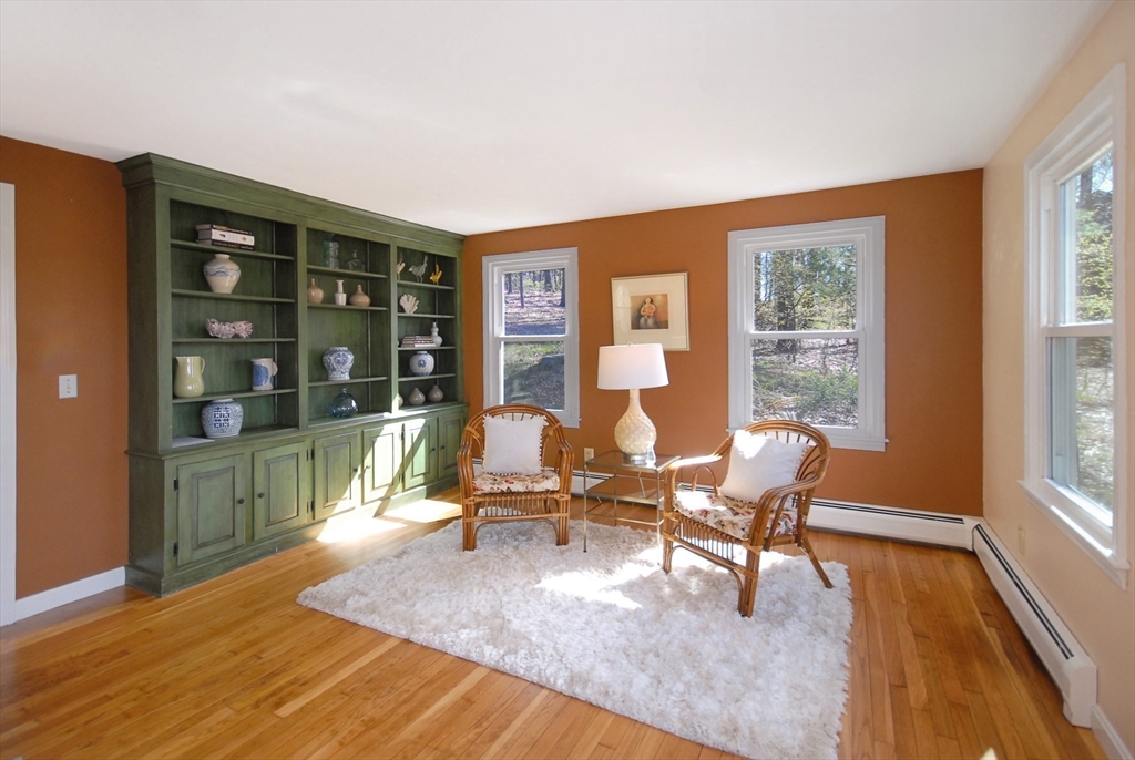 1 Pomfret Road Chelmsford, MA 01824 - Photo 8 of 28 a living room filled with furniture and large windows