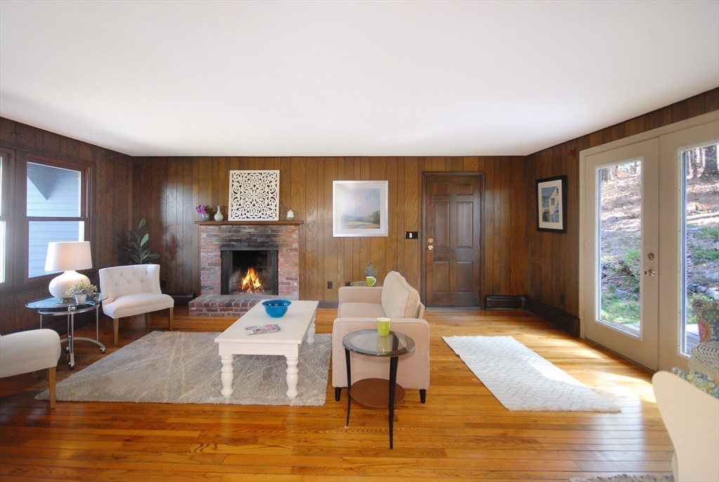 1 Pomfret Road Chelmsford, MA 01824 - Photo 9 of 28 a living room with furniture and a fireplace