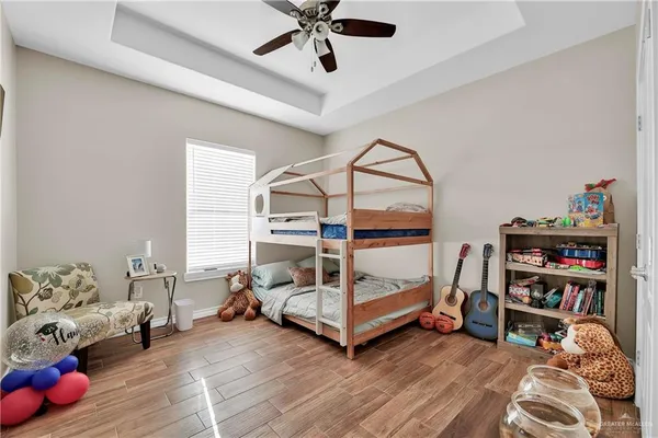 a bedroom with bed and a window