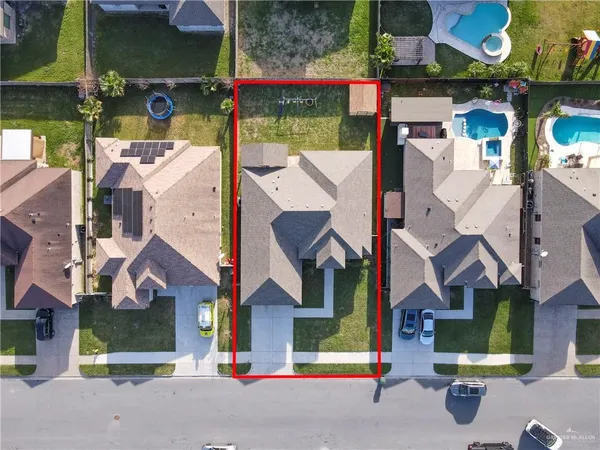 an aerial view of houses with street