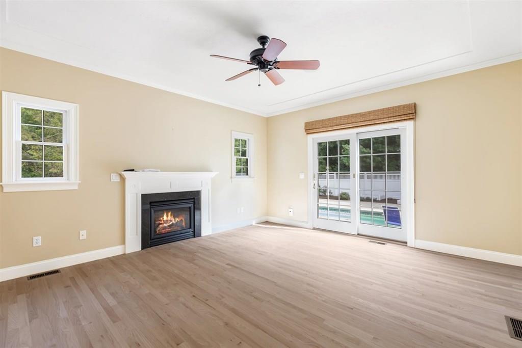 21 Hayden Ridge Plymouth, MA 02360 - Photo 12 of 34 a view of an empty room with a fireplace and a window