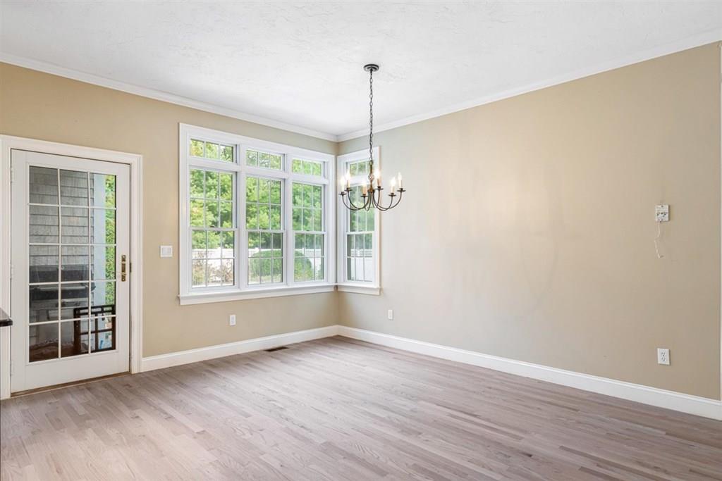 21 Hayden Ridge Plymouth, MA 02360 - Photo 14 of 34 a view of a room with wooden floor and windows