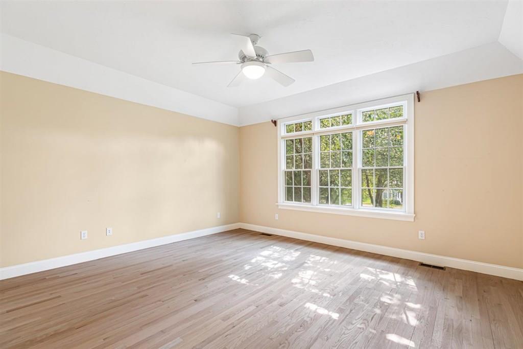 21 Hayden Ridge Plymouth, MA 02360 - Photo 16 of 34 a view of an empty room with wooden floor and a window