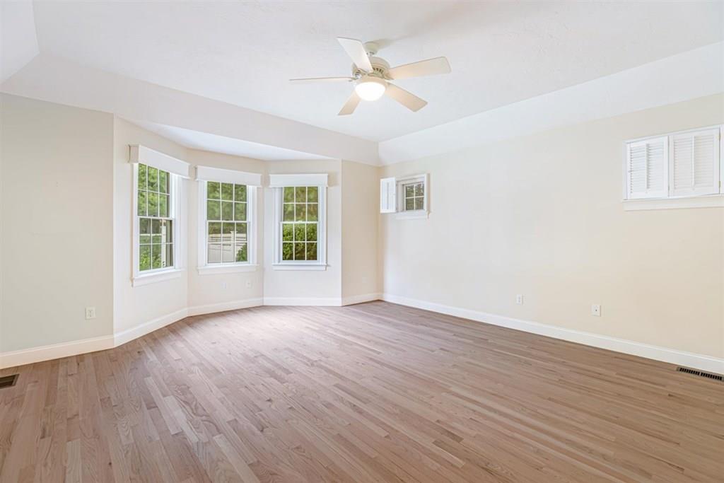 21 Hayden Ridge Plymouth, MA 02360 - Photo 23 of 34 a view of an empty room with wooden floor and a window