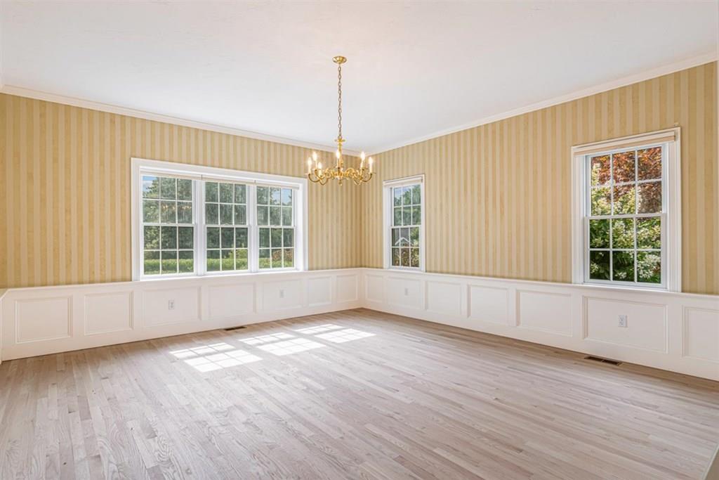 21 Hayden Ridge Plymouth, MA 02360 - Photo 26 of 34 a view of an empty room with wooden floor and a window