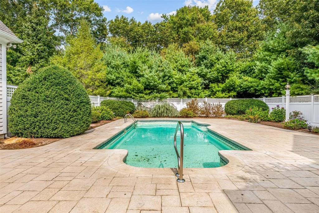 21 Hayden Ridge Plymouth, MA 02360 - Photo 28 of 34 a white and yellow house with a yard and plants