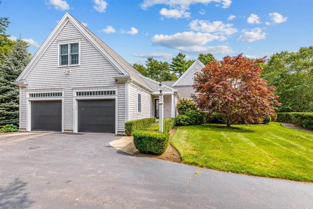 21 Hayden Ridge Plymouth, MA 02360 - Photo 3 of 34 a front view of a house with a yard and garage