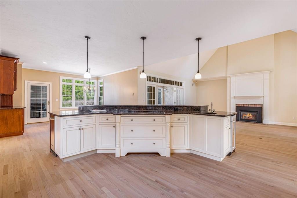 21 Hayden Ridge Plymouth, MA 02360 - Photo 5 of 34 a kitchen with stainless steel appliances granite countertop a stove a sink dishwasher and a wooden floor