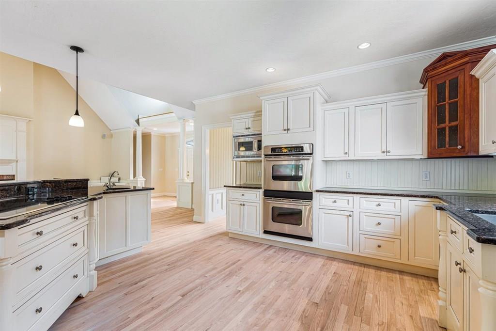 21 Hayden Ridge Plymouth, MA 02360 - Photo 6 of 34 a kitchen with granite countertop white cabinets and stainless steel appliances