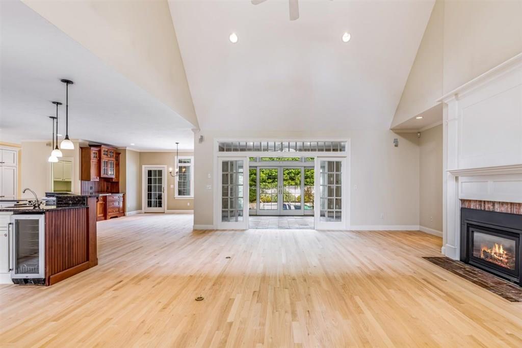 21 Hayden Ridge Plymouth, MA 02360 - Photo 8 of 34 wooden floor fireplace and windows in an empty room