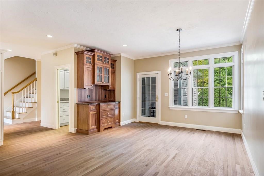 21 Hayden Ridge Plymouth, MA 02360 - Photo 9 of 34 a view of an empty room with a window and wooden floor