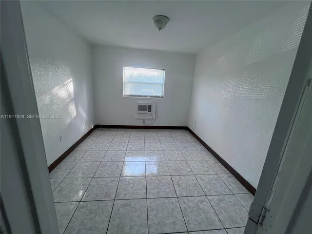 en empty room with windows