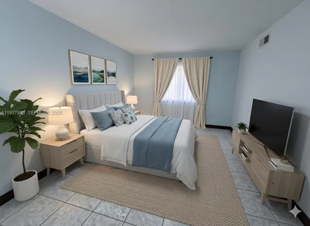 a bedroom with a bed and flat screen tv