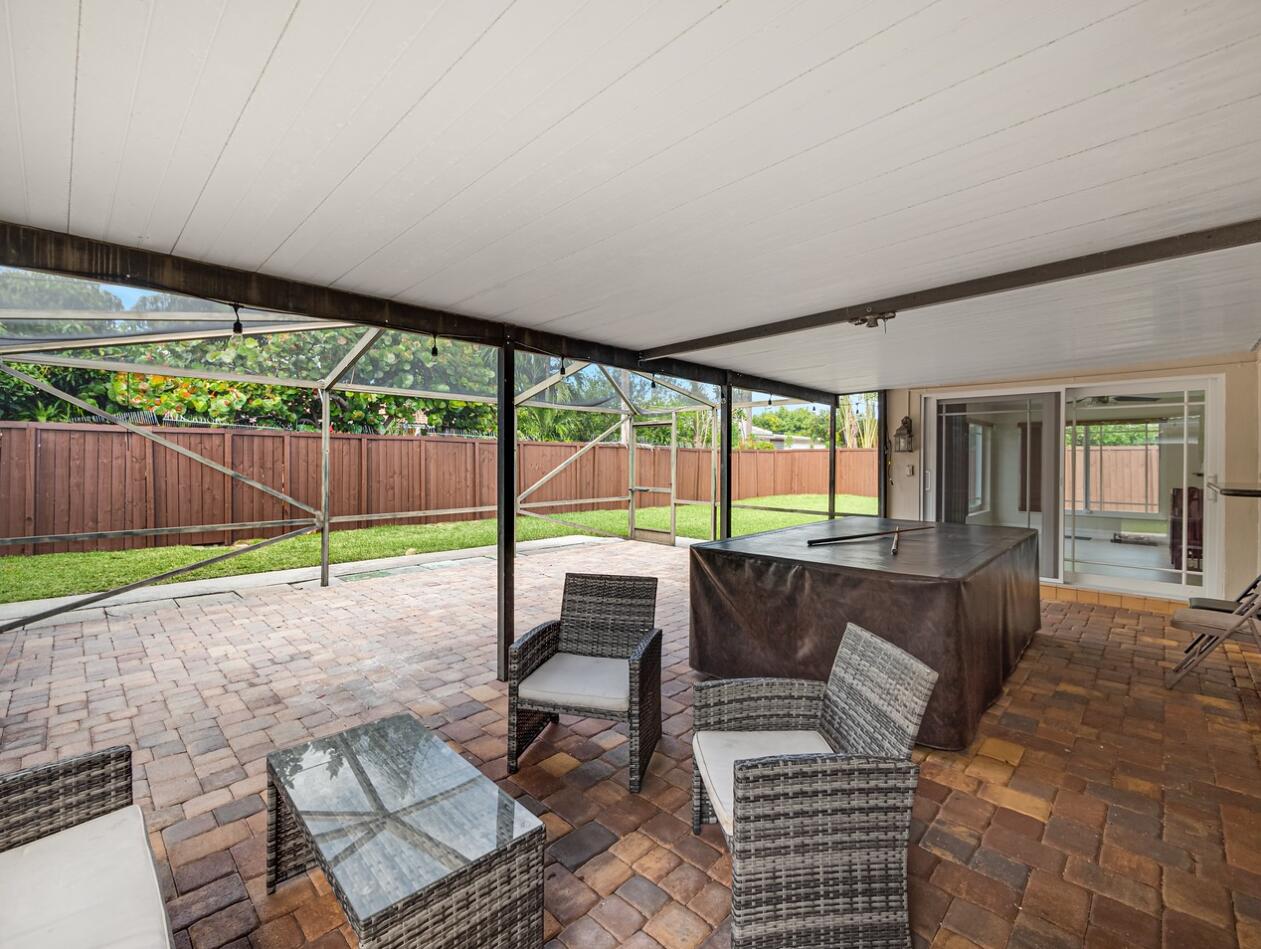355 Northeast 24th Street Boca Raton, FL 33431 - Photo 12 of 15 a living room with furniture and a floor to ceiling window