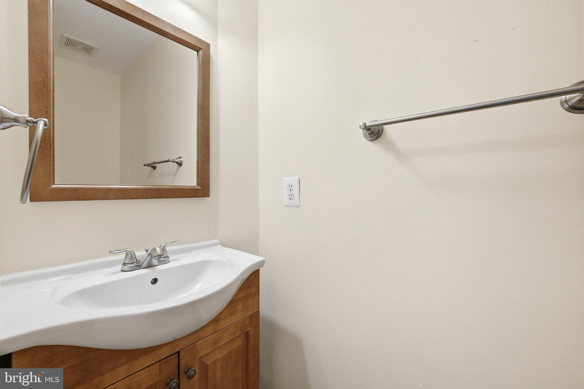 3679 Expedition Drive Triangle, VA 22172 - Photo 10 of 65 a bathroom with a sink and a mirror
