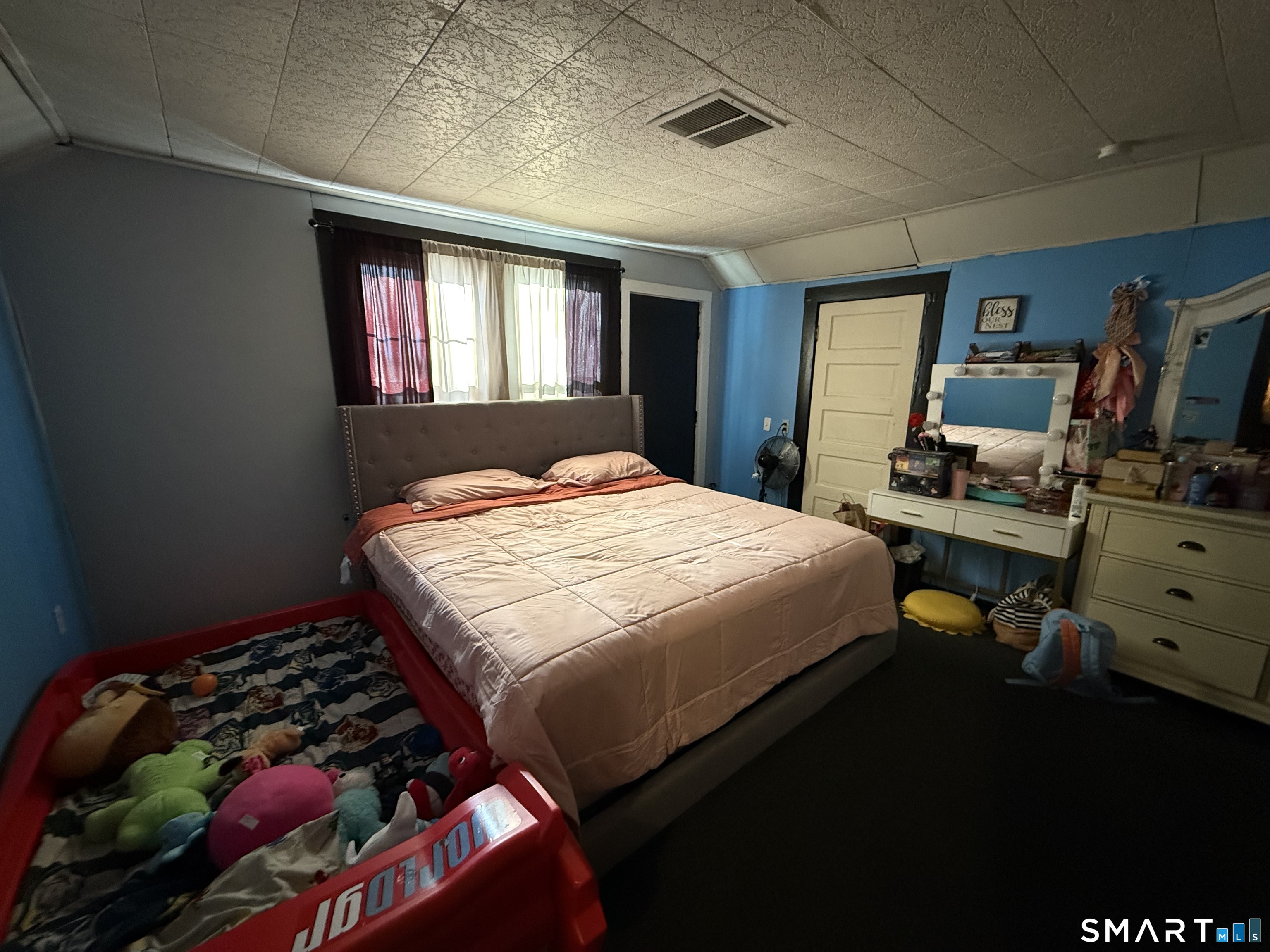 74 George Street Bristol, CT 06010 - Photo 5 of 12 a bedroom with a bed and a window
