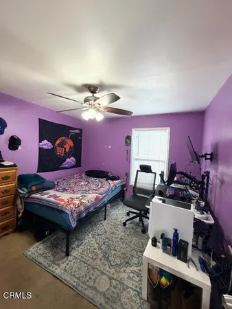a bedroom with furniture and a chandelier