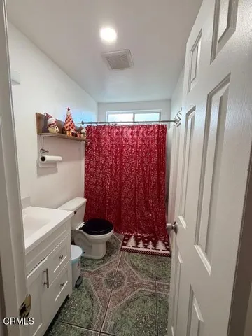 a bathroom with a toilet a sink and bathtub