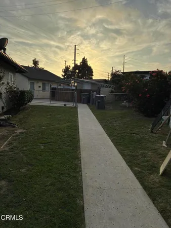 a view of a lake with a yard