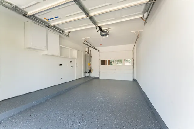 a view of a utility room with closet and windows