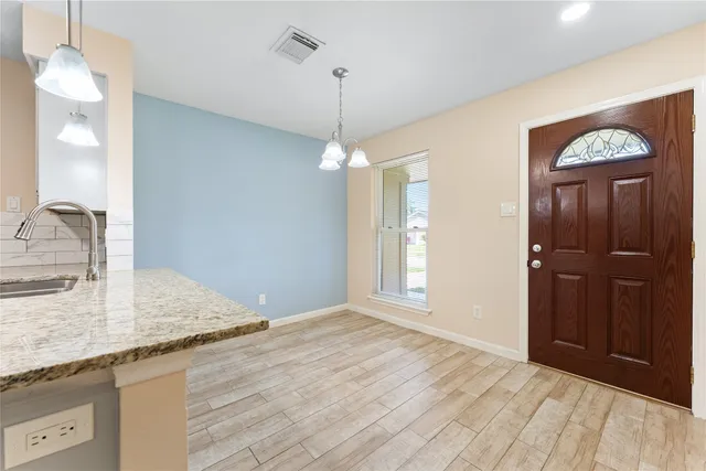 a view of a kitchen cabinets and wooden floor