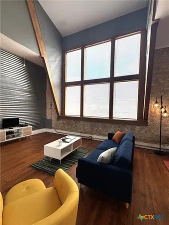 a room with furniture and wooden floor